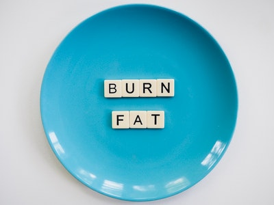 photo-of-a-burn-fat-text-on-round-blue-plate-2383009